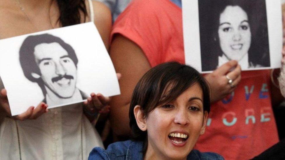 A woman named Adriana (she wished not to release her current last name), who was taken away from her mother during the 1976-1983 Argentine dictatorship, speaks during a news conference at the human rights organization Abuelas de Plaza de Mayo (Grandmothers of Plaza de Mayo) headquarters in Buenos Aires, Argentina December 5, 2017