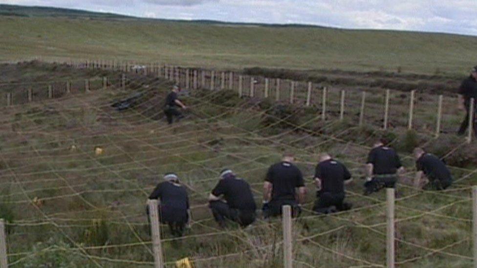 Police searching a bog for David Sullivan's body