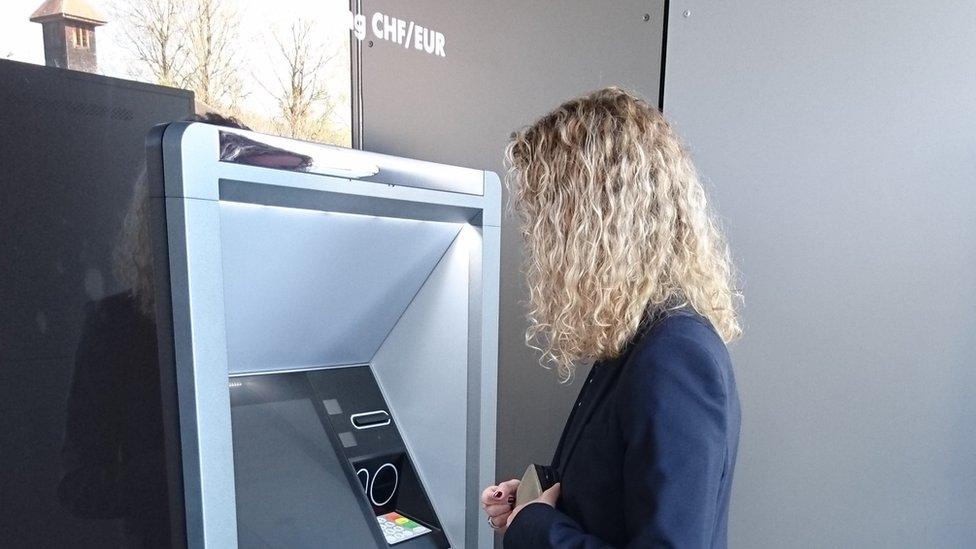 Customer in Switzerland uses new ATM