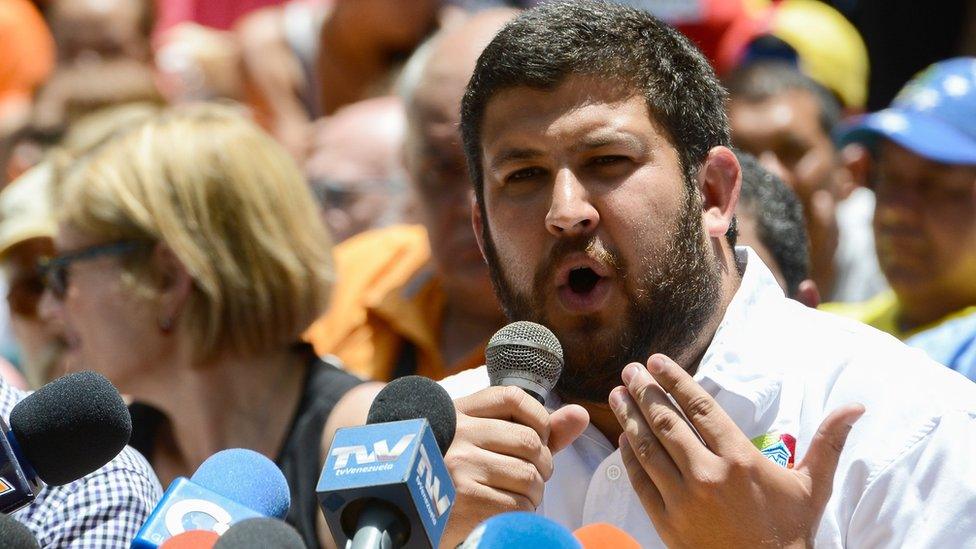 El Hatillo's Mayor David Smolansky speaks next to other opposition mayors during a press conference at Bolivar square in the Chacao neighbourhood in Caracas, on May 25, 2017