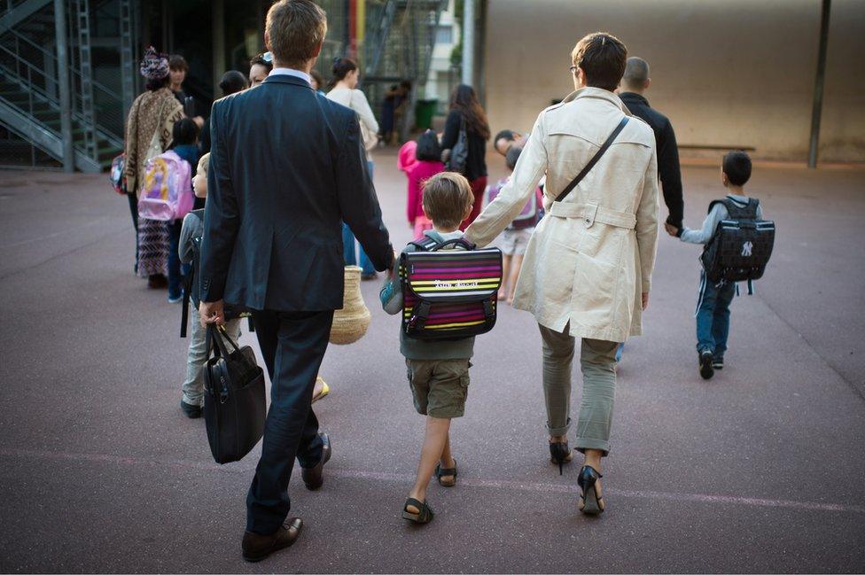 French parents take child to school