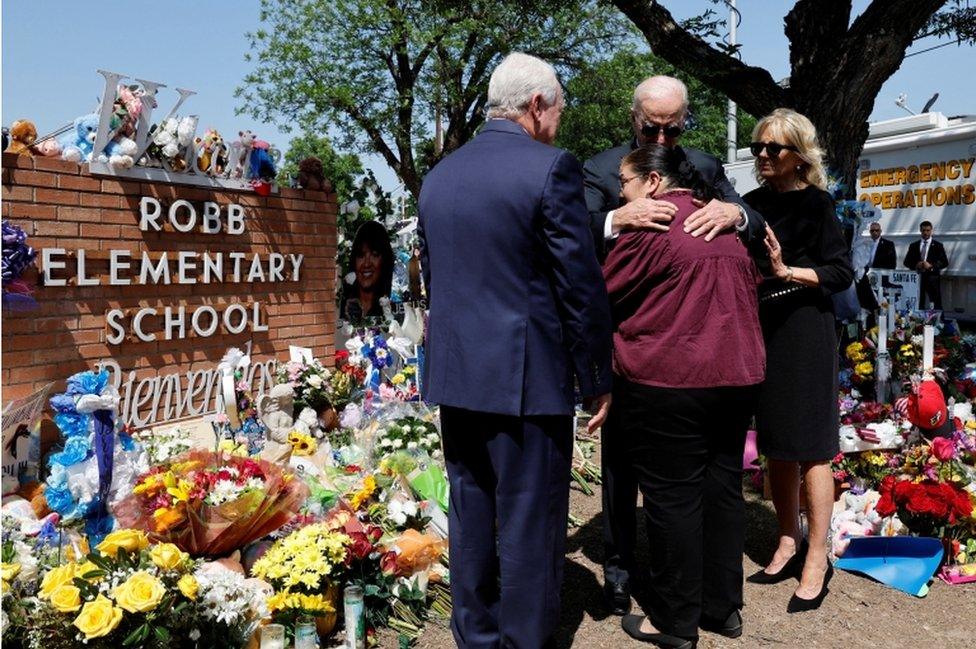 President Biden pictured hugging Mandy Gutierrez, as First Lady Jill Biden stands with her hand on his arm