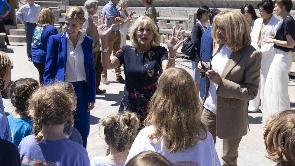 Carrie Johnson, Jill Biden and Brigitte Macron.