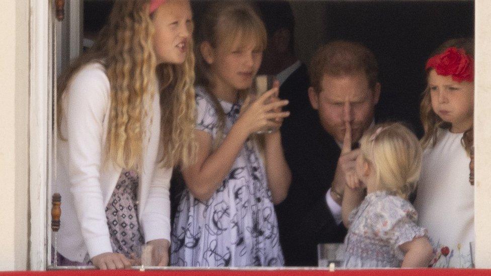 Prince Harry with Savannah Phillips and Mia Tindall in the Major General's office overlooking The Trooping of the Colour on Horse Guards Parade