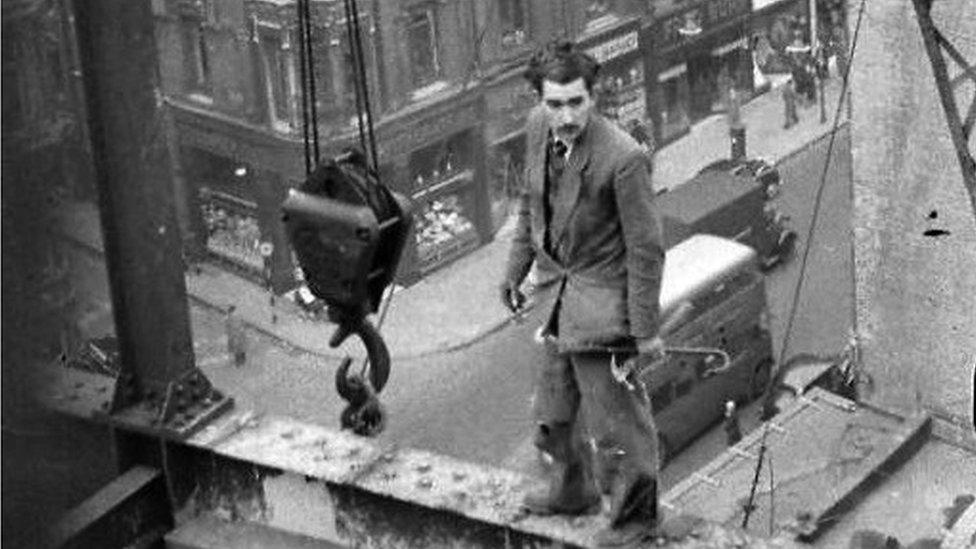 Fabian Cowan standing on scaffolding