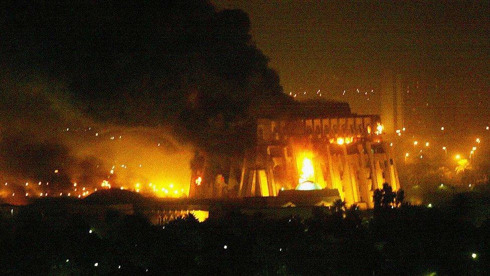 Fires burn in and around Saddam Hussein's Council of Ministers building during the first wave of attacks in the "shock and awe" phase of "Operation Iraqi Freedom" on March 21, 2003 in Baghdad, Iraq