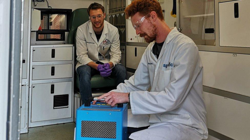 Anthony Lewis and Ed Lester-Card testing out a pump that would be used for cleaning