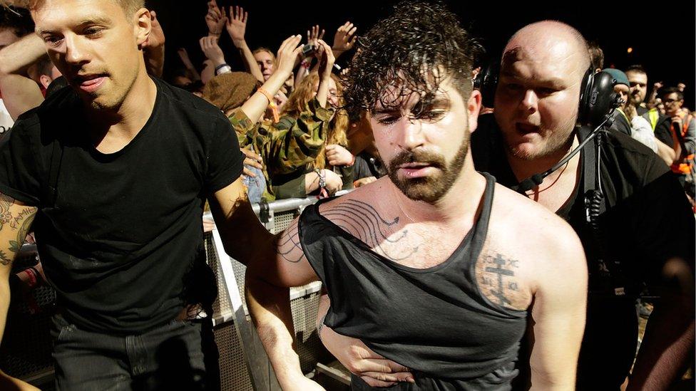 Yannis Philippakis from Foals with security