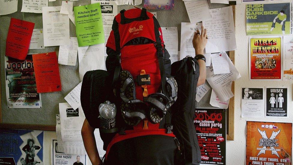 Backpacker at jobs board