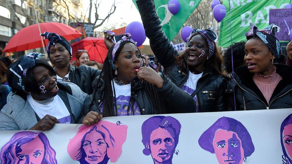 Women attend a demonstration on the occasion of the International Women's Day in Madrid