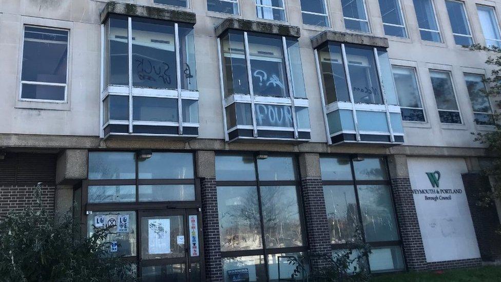 North Quay offices with graffiti on the windows