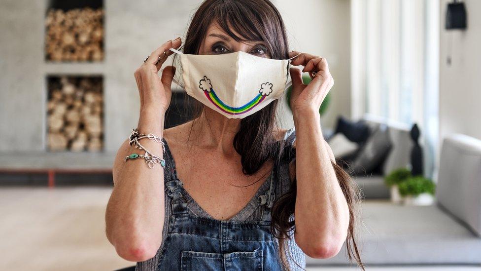 Woman with rainbow smile facemask