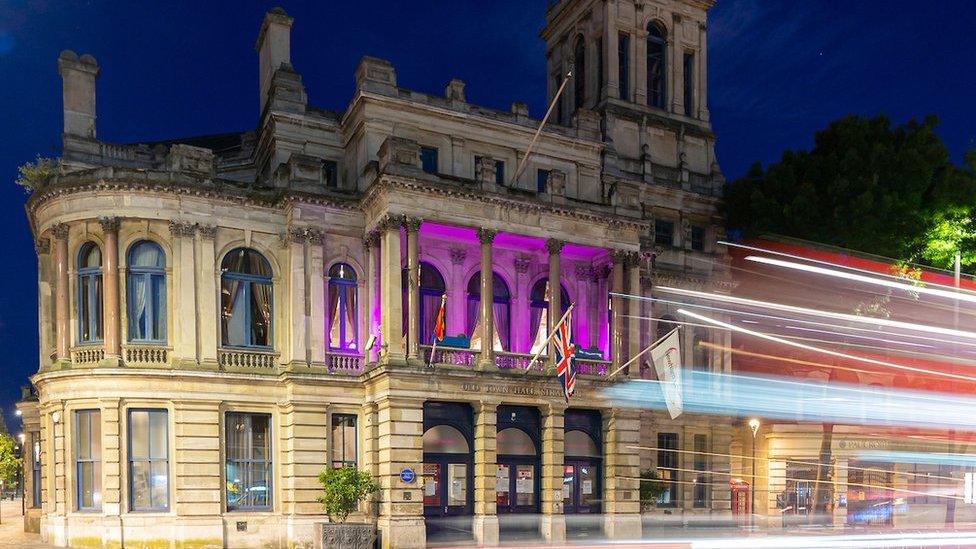 A building in Newham lit up purple