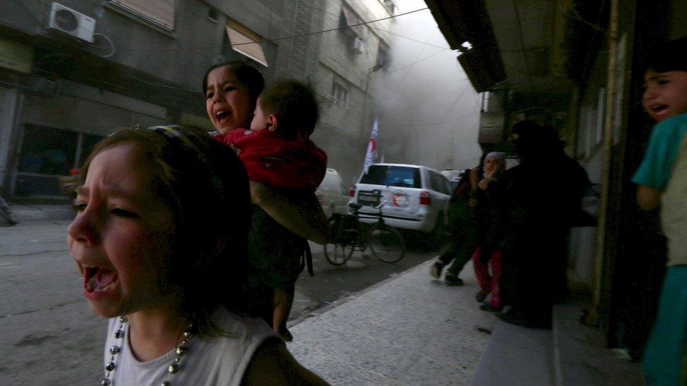 Girls react after what activists said was shelling by forces loyal to Syria"s President Bashar al-Assad in the Douma neighborhood of Damascus, Syria May 6, 2015