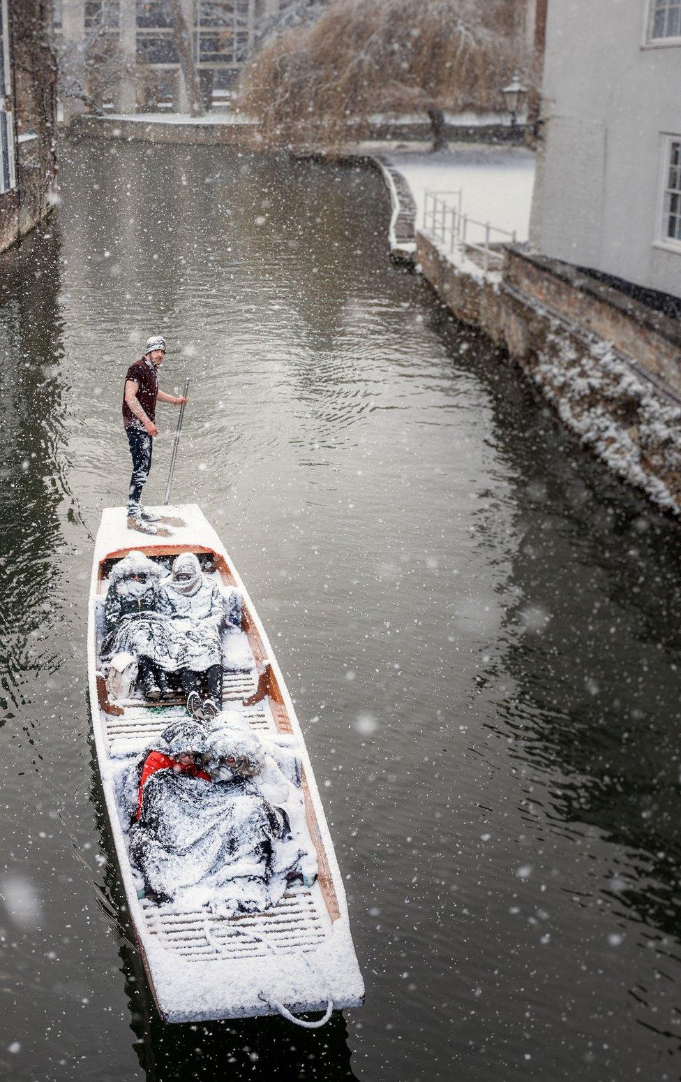 People punting on the River Cam in Cambridge