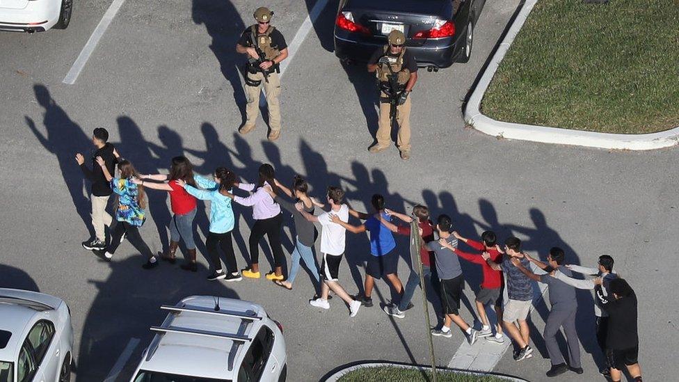 Students being led out of the school on the day of the attack