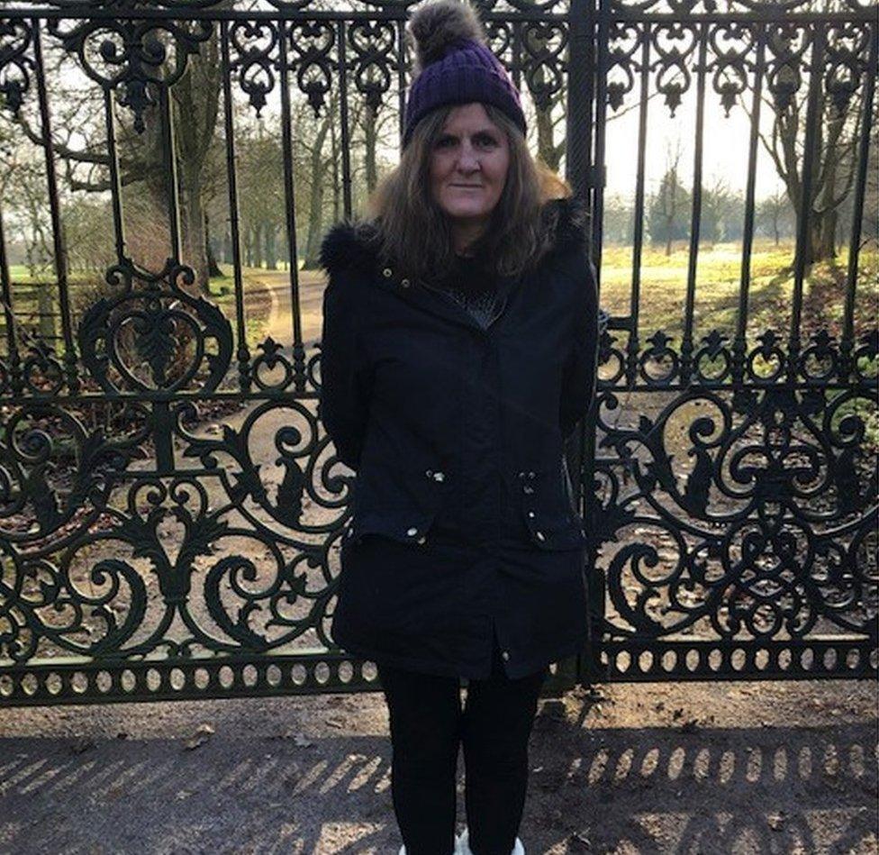 Mandy Sansum standing in front of the gates at Maunsel House