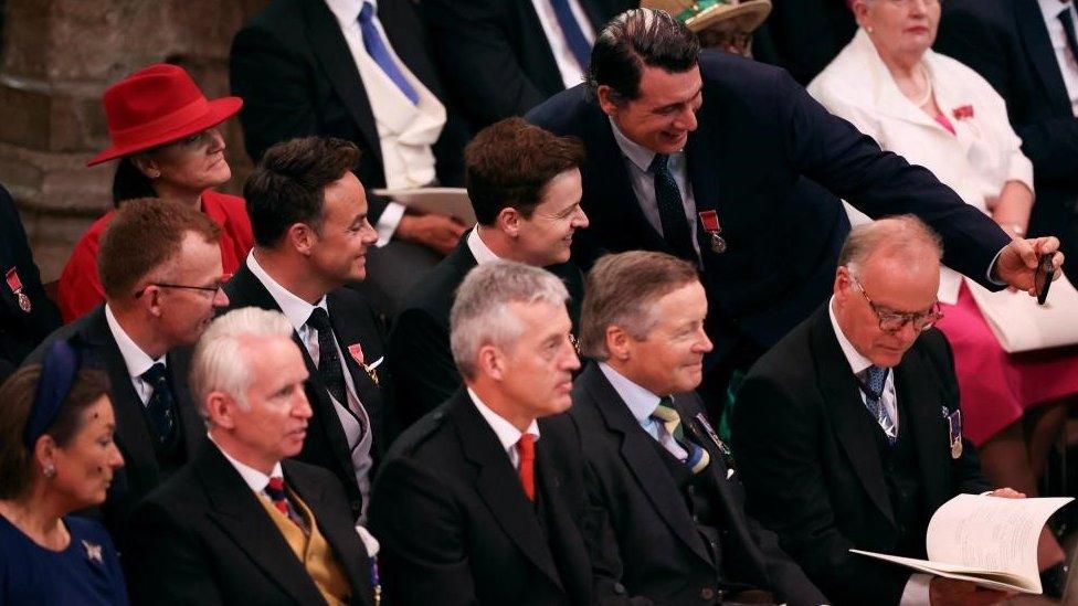 A guest takes a selfie with Ant and Dec in Westminster Abbey