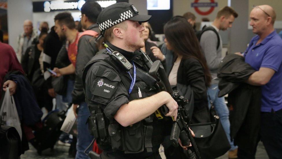 Armed policeman on the Tube network in London