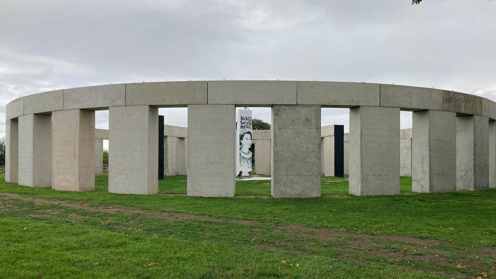 The "Stonehenge" style artwork in the daytime