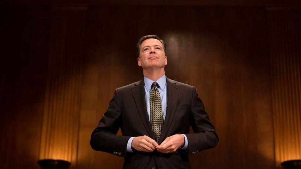 James Comey prepares to testify before a Senate committee.