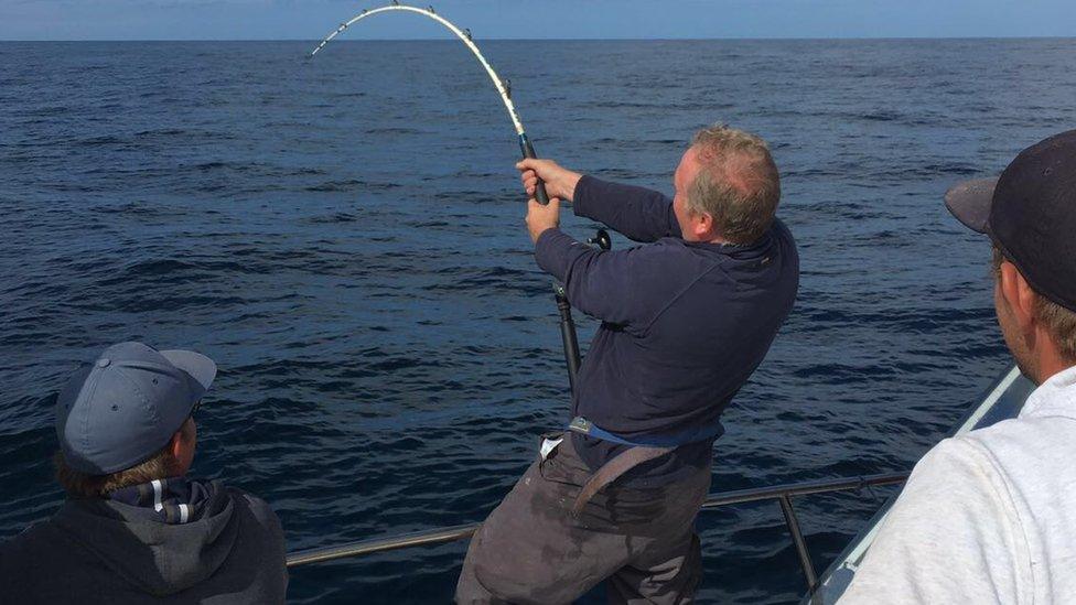 Andrew Alsop catching the tuna