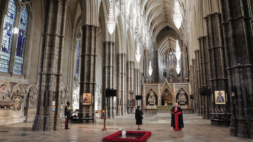 The Queen, her Equerry and the Dean of Westminster Abbey, David Hoyle, during a ceremony in London"s Westminster Abbey