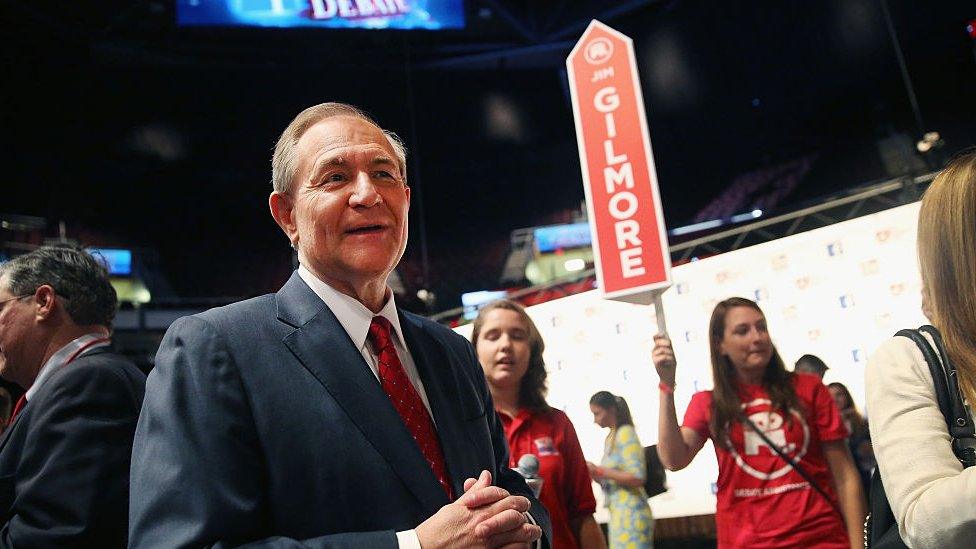 Jim Gilmore talks after the Republican debate in Iowa.