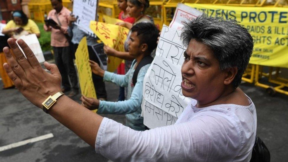 Indian Dalit rights activists, intellectuals and journalists shout slogans against the police raid and illegal arrest of human right activists