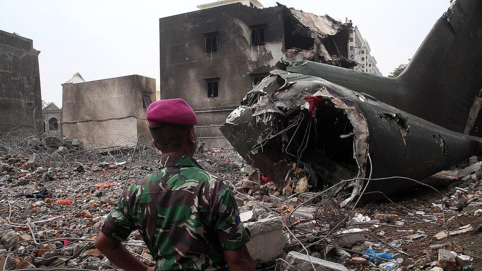 Debris of C-130 Hercules on houses in Medan, Indonesia (1 July 2015)