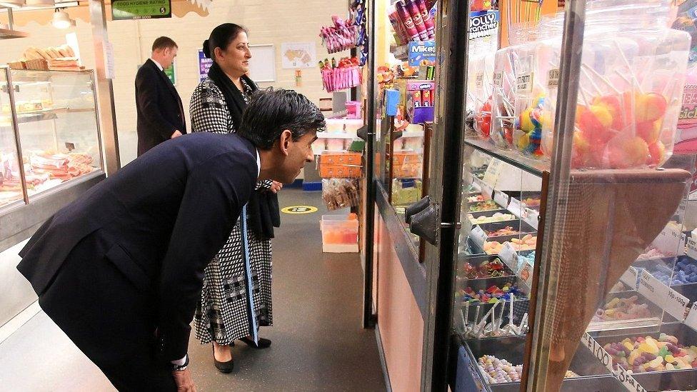 Rishi Sunak stops at a sweet shop at the Bury Market