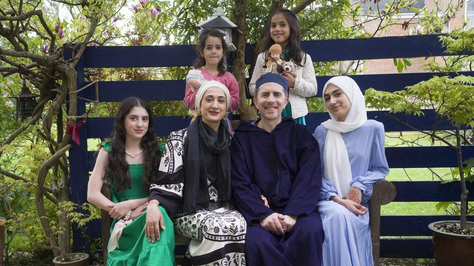 Eid al-Fitr, the celebration that marks the end of Ramadan on the Bank Holiday Monday 2nd June 2022. Everyone is wearing something new for the Eid which they have selected themselves reflecting their distinct personalities. It is a very British Muslim family photo taken in the Buckinghamshire garden of my father-in-law, the photographer Peter Sanders who took the photographs.