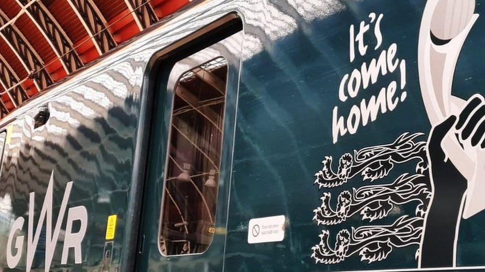Train with 'It's come home' on the side