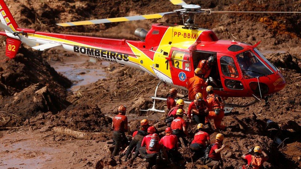 Rescuers search for victims at the site of the disaster - 28 January