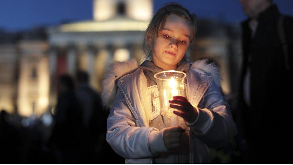 Girl holding candle