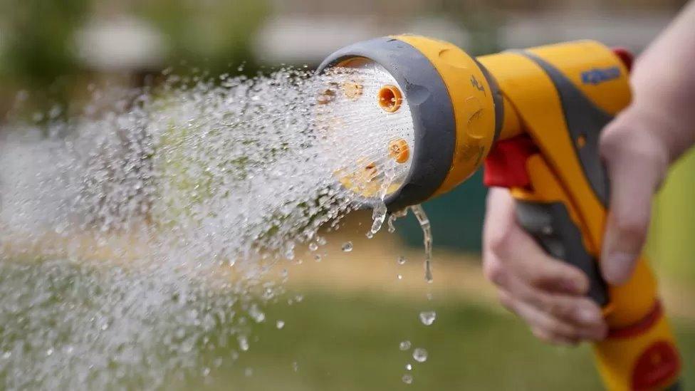 A hosepipe spraying water