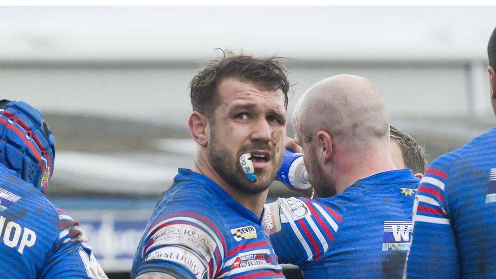 Scott More playing rugby