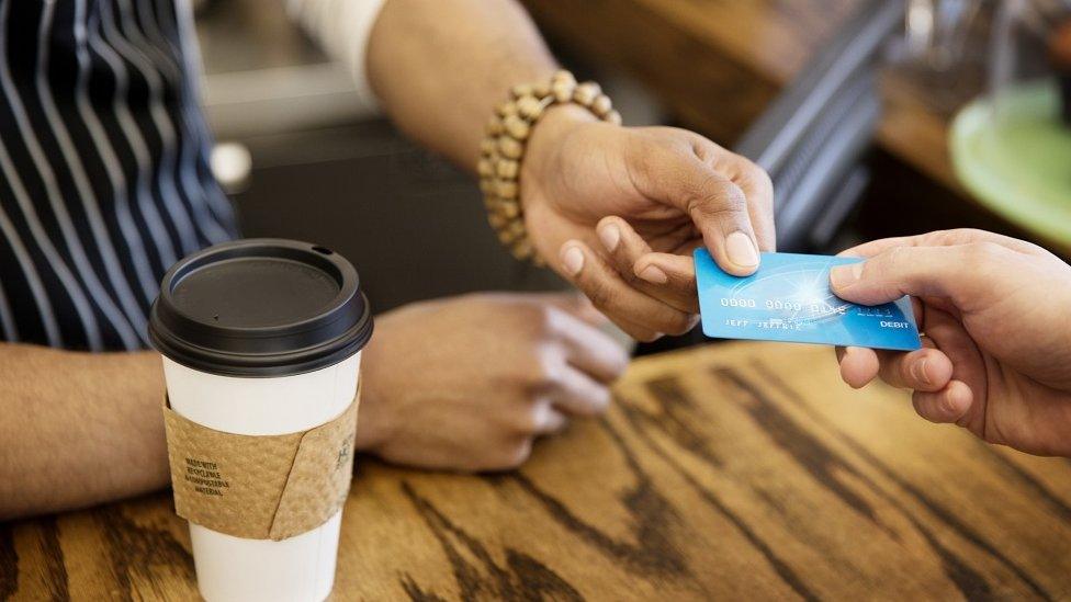 Person buying a coffee