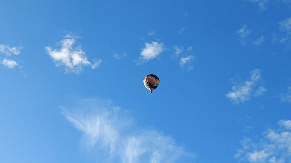 A hot air balloon flying in the sky