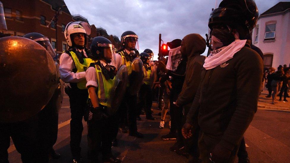 Protesters confront police