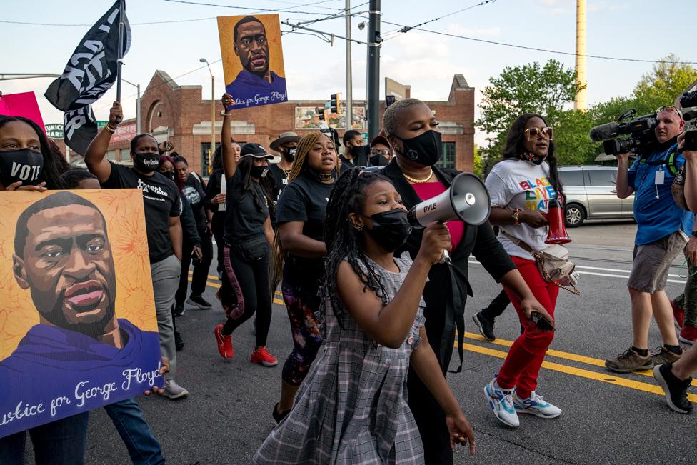 People march through the streets after the verdict was announced for Derek Chauvin on 20 April 2021 in Atlanta