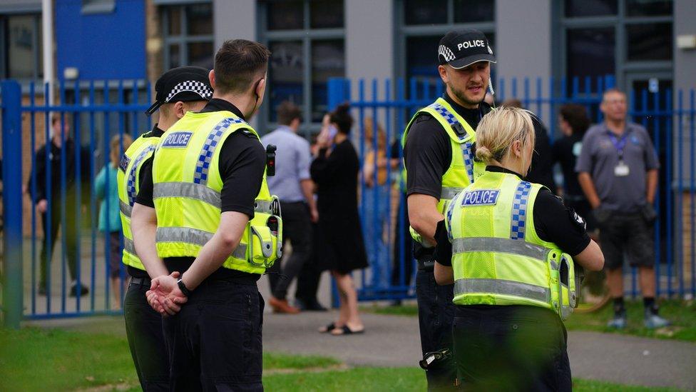 Police officers outside the Tewkesbury School