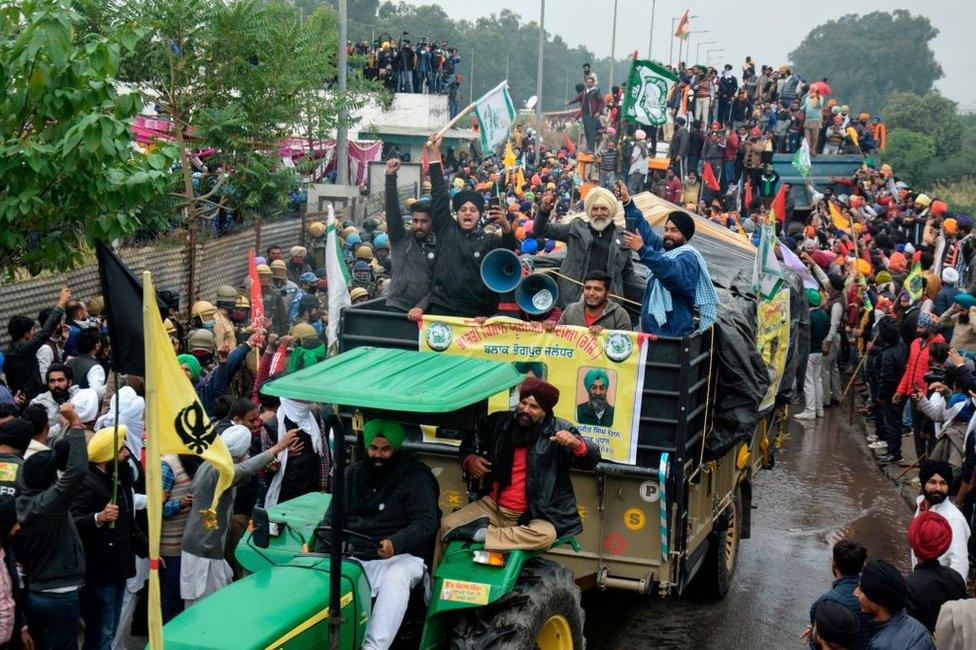 Farmers shout slogans as they take part in a march to India's capital New Delhi to protest against the central government's recent agricultural reforms, in Ambala on November 26, 2020.