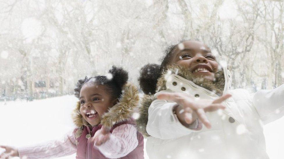 two-girls-play-in-snow