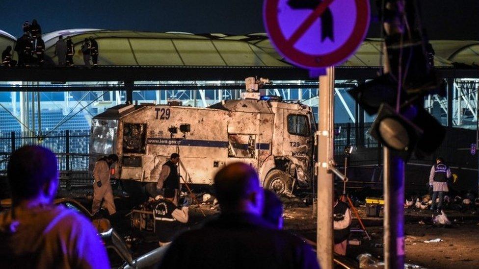 Forensic officers at the site where a car bomb exploded near the stadium of football club Besiktas in central Istanbul on December 10