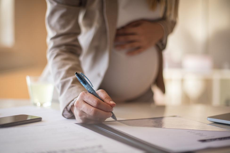 A pregnant woman at work