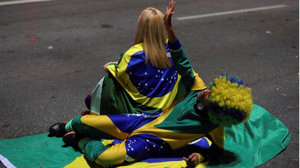 Supporters of Jair Bolsonaro, far-right lawmaker and presidential candidate of the Social Liberal Party (PSL), react after Bolsonaro wins the presidential race, in Sao Paulo, Brazil O