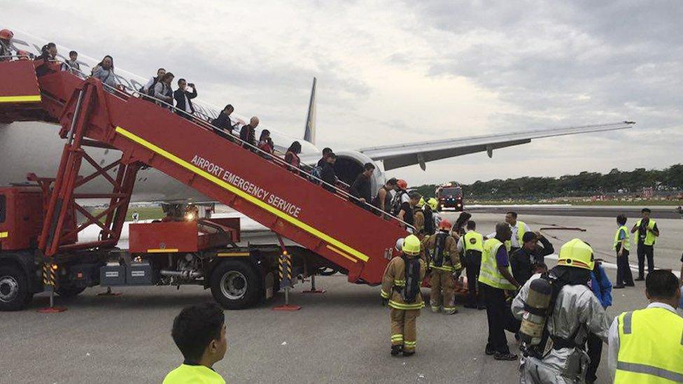 This image provided by Lee Bee Yee shows the aftermath of an engine fire on a Singapore Airlines flight, at Changi International Airport on Monday, June 27, 2016.