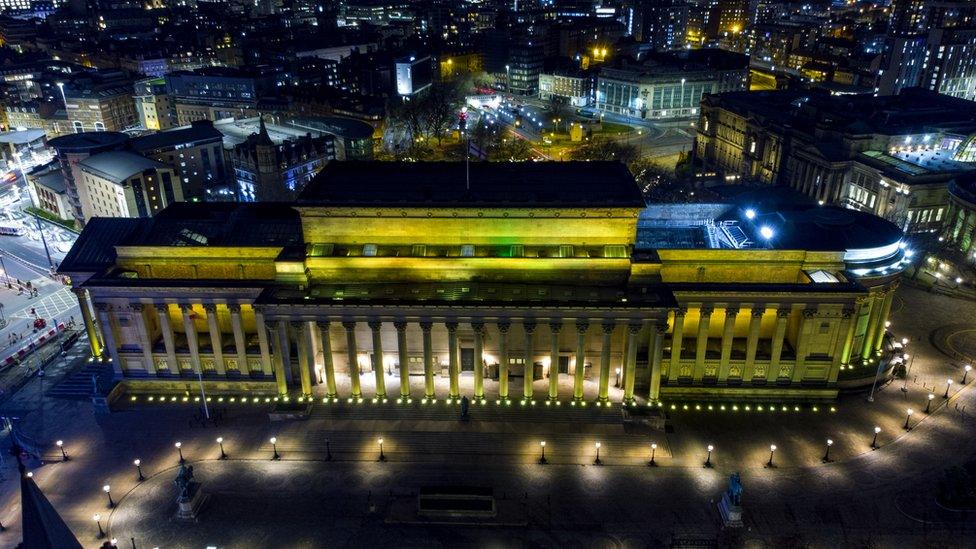 St George's Hall in Liverpool lit up yellow