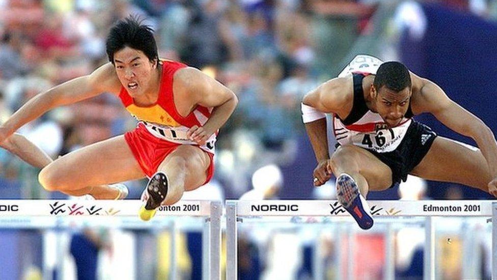 Liu Xiang of China (L) and Jerome Crews of Germany at the Commonwealth Stadium in Edmonton Canada (07 August 2001)